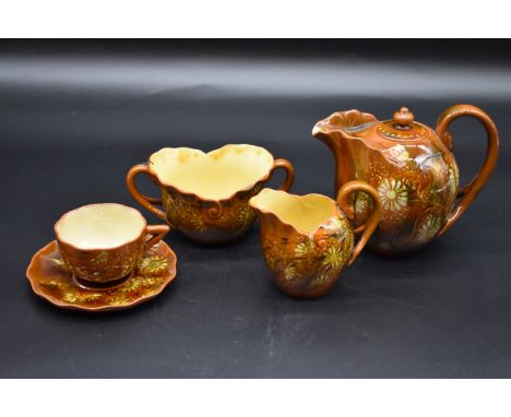 A Linthorpe pottery bachelor's teaset, possibly by Christopher Dresser, the teapot 12.5cm high. 