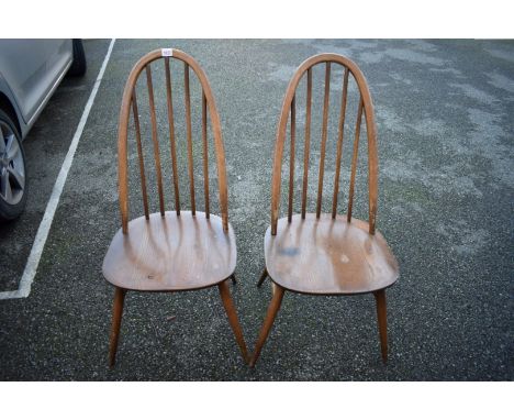 A pair of Ercol dining chairs. 