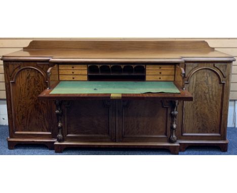 GOOD VICTORIAN MAHOGANY SECRETAIRE BREAKFRONT SIDEBOARD with shaped back rail over a moulded edge top, the central drawer wit