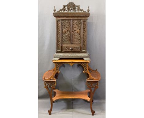 CIRCA 1900 INDIAN CARVED HARDWOOD TABLE CABINET with an Edwardian mahogany fancy side table, the cabinet having peacock pierc