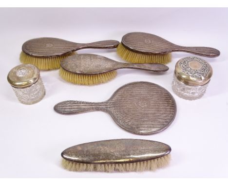 HALLMARKED SILVER DRESSING TABLE ITEMS (6) and one other to include a three-part hand mirror and two-brush set with engine tu