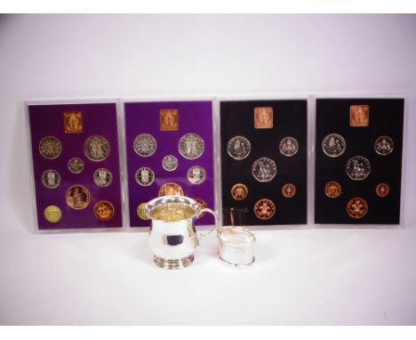 SMALL SILVER, TWO ITEMS and four proof coin sets, 7cms H child's christening tankard, Birmingham 1931, maker Marson &amp; Jon