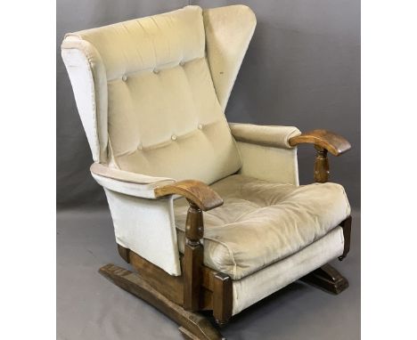 VINTAGE STYLE OAK FRAMED ROCKING WING-BACK ARMCHAIR with button upholstery, 87.5cms H, 64cms W, 49cms seat depth, label appli