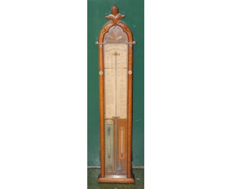 Admiral Fitzroy barometer in carved oak and glazed case with all attendant interior paper scales, atmosphere panel and thermo