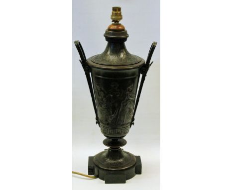 Bronzed classical urn electric table lamp with twin handles and relief figure decoration on shaped black marble base, 50cm hi