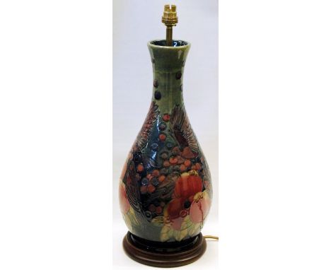 Moorcroft large electric table lamp decorated with birds and fruit on wood base, lamp and base 45cm high.