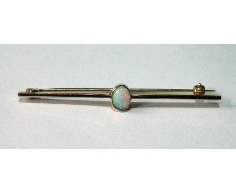 Gold pin with oval collet-set opal, probably 18ct gold. Condition Report 2.6g
