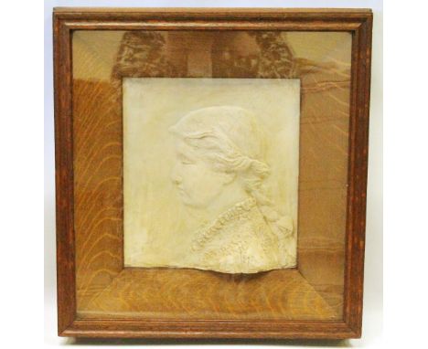 Clay relief portrait of a lady, monogrammed C.H., in deep oak and glazed frame, 39.5cm x 35cm. Condition Report Has not been 