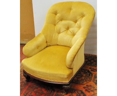 Victorian nursing armchair with carved oak frame, button back and arms.