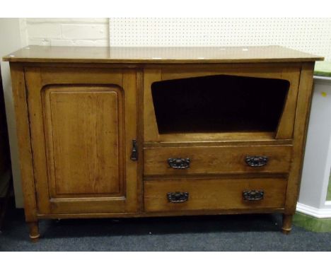 A small Edwardian oak sideboard with cupboard, shelf and two drawers, on turned legs