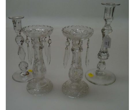 A Victorian cut glass table candlestick, with spreading foot, together with one smaller and a pair of 20th century cut glass 