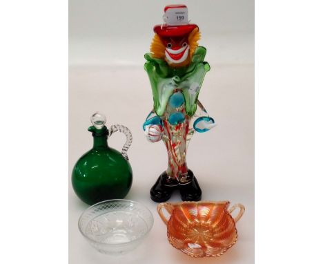 A large Murano glass clown, a green glass flask with clear handle and stopper, an amber carnival glass dish and other items o