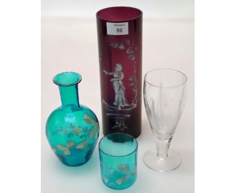 A magenta Mary Gregory-style cylindrical vase, a blue glass water carafe and beaker enamel decorated with trailing leaves, th