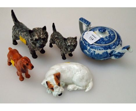 A Royal Doulton porcelain figure of a cocker spaniel, standing four square, together with three other Royal Doulton figures (