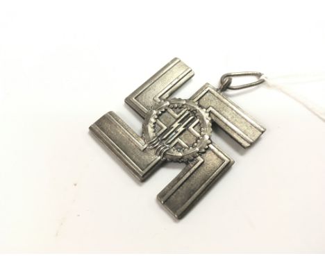 A replica Waffen SS 12 year long service medal in heavy silver plate. A museum quality piece.