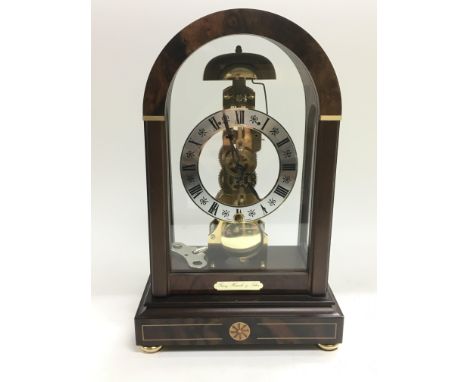 A Franz Hermle &amp; Sohn arch topped skeleton mantle clock.