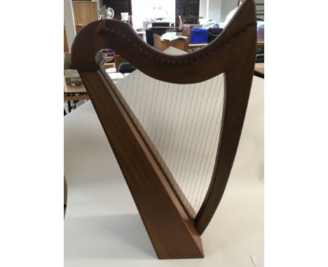 A modern design team framed harp, possibly from The Superior instrument company.