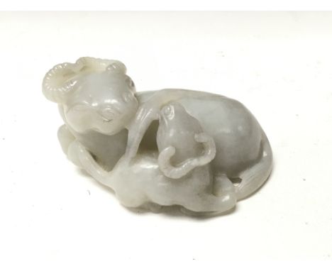 A Chinese carved white jade buffalo.