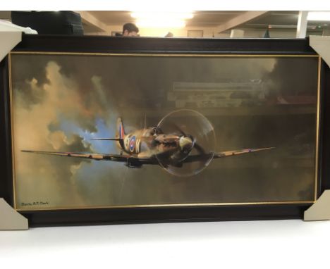 A framed and glazed print of a Spitfire by Barrie A.F. Clark, approx 100 x 57cm.