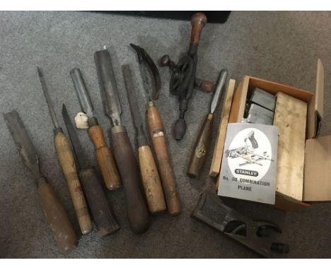 A box of Wooden tools Various including Stanley plane, chisels and a hand drill