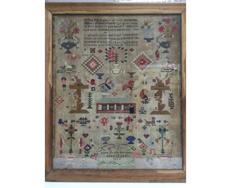 A Victorian sampler dated 1856, approx 60cm x 69cm.