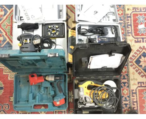 4 X Power tools including a Sander. A Jigsaw. A Impact Driver and a hand held router.(4)
