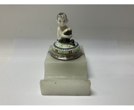 A 1930s inkwell in the form of a satyr with hallmarked silver mounts (some damage).