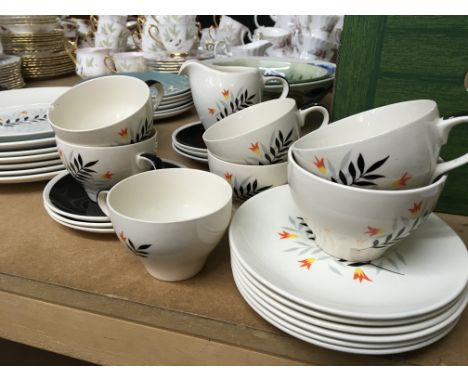 A decorative Wade ceramic tea set and a Doulton Spindrift pattern part dinner set. One cup saucer and plate with chips.