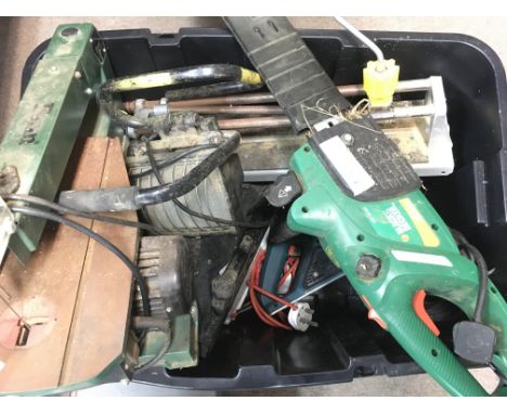 A Box Containing a Collection of ToolS including a Chainsaw. A Tile Cutter. A Sander. Etc.