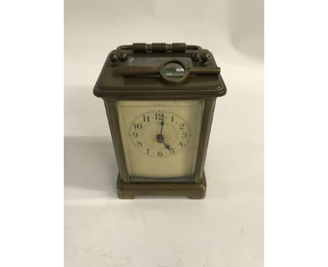 A brass case carriage clock the dial with Arabic numerals - NO RESERVE