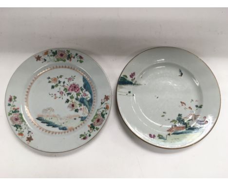 Two Chinese famille rose plates decorated with flowers and animals, approx diameter of largest plate 23cm.