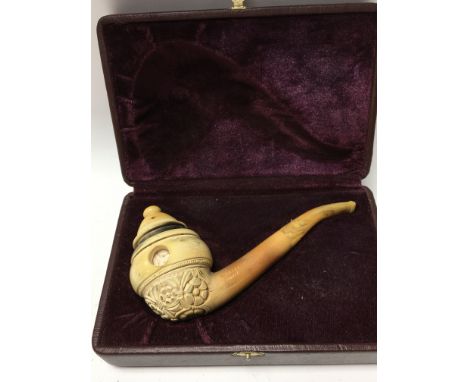 A Meerschaum pipe crafted and signed by the acclaimed pipe Artist Ismail Ozel displaying erotic scenes through a revolving ce