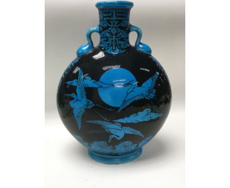 A Minton moon flask decorated with an oriental style with flying crane.