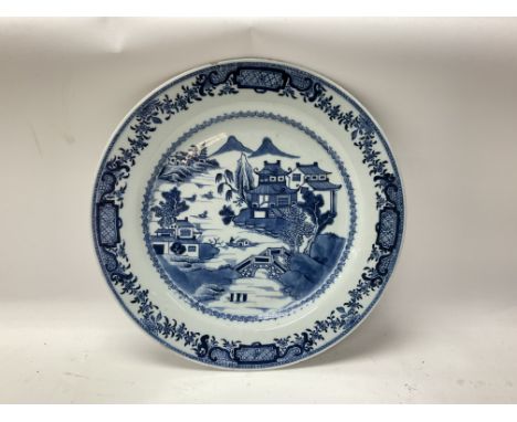 A large Chinese blue and white porcelain plate, 34cm. (Small area of damage).