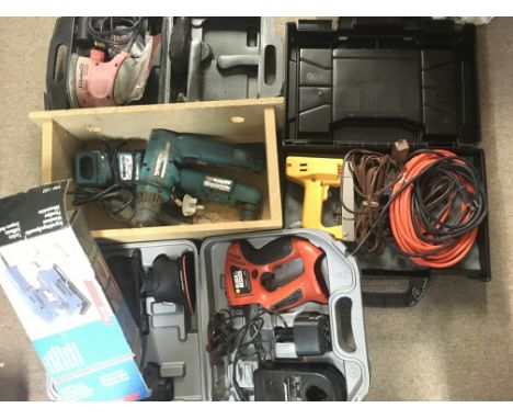 A Collection of Power Tools including Sanders. Electric stapler. And Drills.(5).