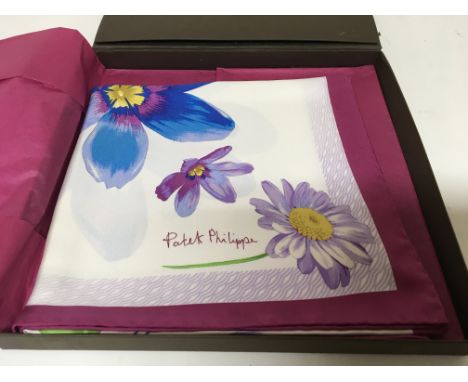 A Patek Philippe silk patterned scarf. In a presentation box.