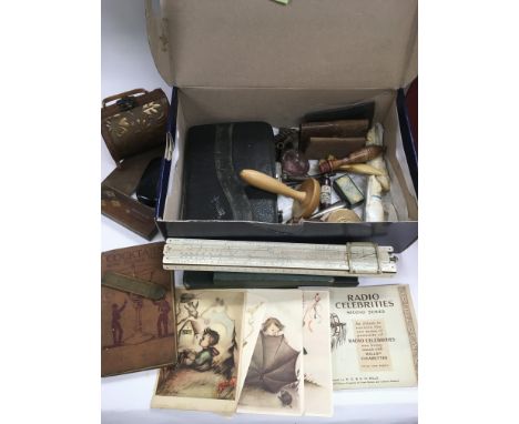 Two boxes of oddments comprising netsuke, cigarette cards, dressing table items etc.