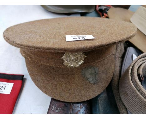 A BRITISH ARMY OFFICERS PEAKED CAP 