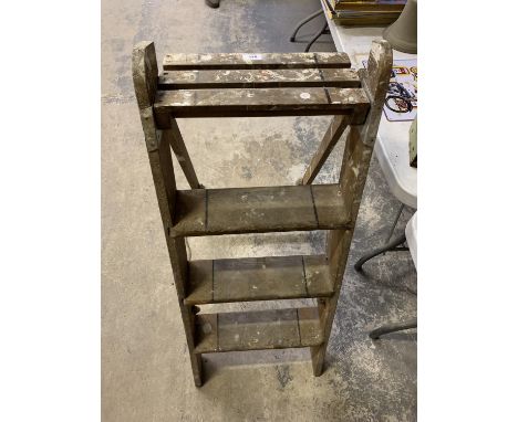 A WOODEN VINTAGE STEP LADDER 