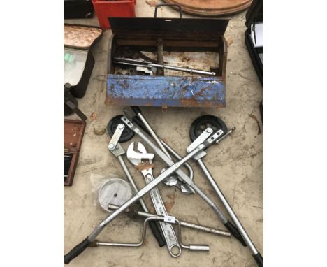 VARIOUS PIPE BENDING TOOLS, A LARGE SPANNER AND A METAL TOOL BOX ETC 