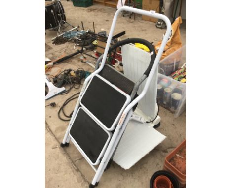 TWO SETS OF FOLDING TWO STEP LADDERS AND A AQUATEC BATH CHAIR 