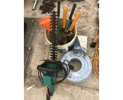 A BLACK AND DECKER HEDGECUTTER, VARIOUS GARDEN HAND TOOLS AND A HOSE PIPE IN WORKING ORDER 