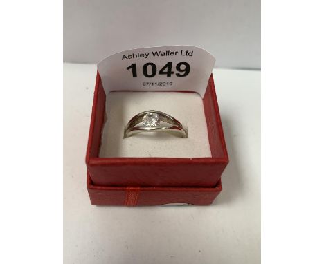 A SINGLE STONE SOLITAIRE RING, BOXED 