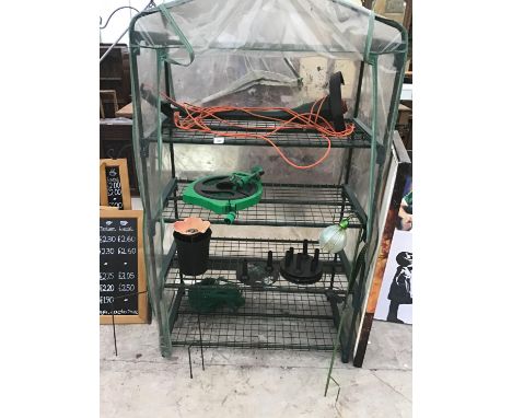 A CLOCHE COVERED FRAME, A HOSE PIPE, HANGING BASKET STAND, SOLAR LIGHTS, HOSE PIPE AND A BLACK AND DECKER STRIMMER IN WORKING