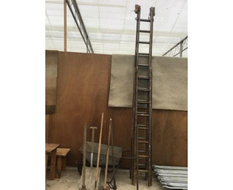 TWO SETS OF WOODEN EXTENDING LADDERS (SIXTEEN RUNG TWO SECTION AND A TWENTY SIX RUNG TWO SECTION), A WHEELBARROW AND VARIOUS 