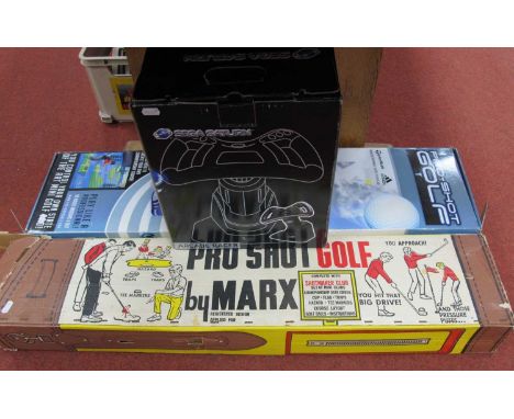 A Sega Saturn Arcade Racer steering controller, Marx Pro Shot Golf and a mini golf pro-shot golf game, boxed.