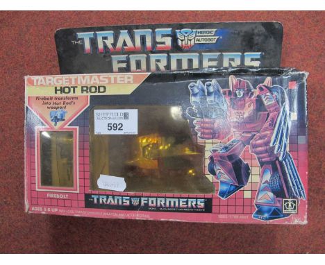 A boxed circa 1980's Hasbro Transformers #5883/5768 Targetmaster Hot Rod, Firebolt, Instruction Sheet, Stickers, opened packa