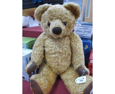 A Mid XX Century Plush Teddy Bear, probably Chad Valley, fully jointed, high, well loved.