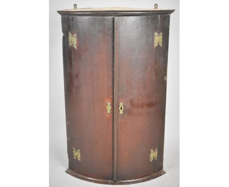 A 19th Century Bow Fronted Wooden Hanging Corner Cabinet with Shaped Top Shelf, 59cm wide and 91cm high