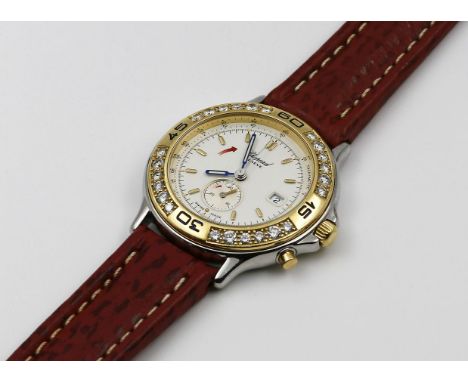 Damenarmbanduhr "Chopard". Modell "Mille Miglia Diamonds". Rundes Edelstahlgehäuse mit 750/000 GG, Lunette besetzt mit 24 Bri